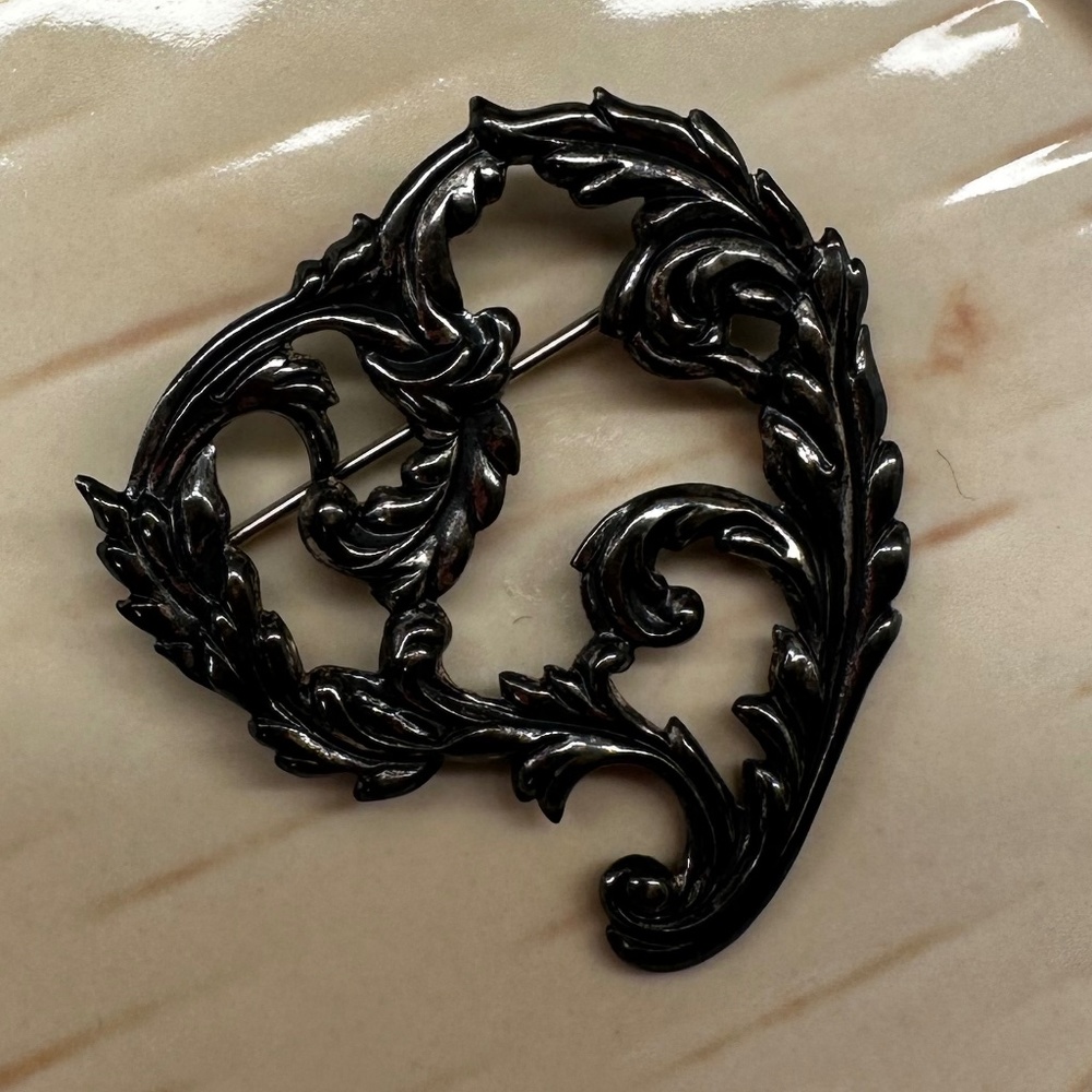 Interesting vintage dark silver retro pin